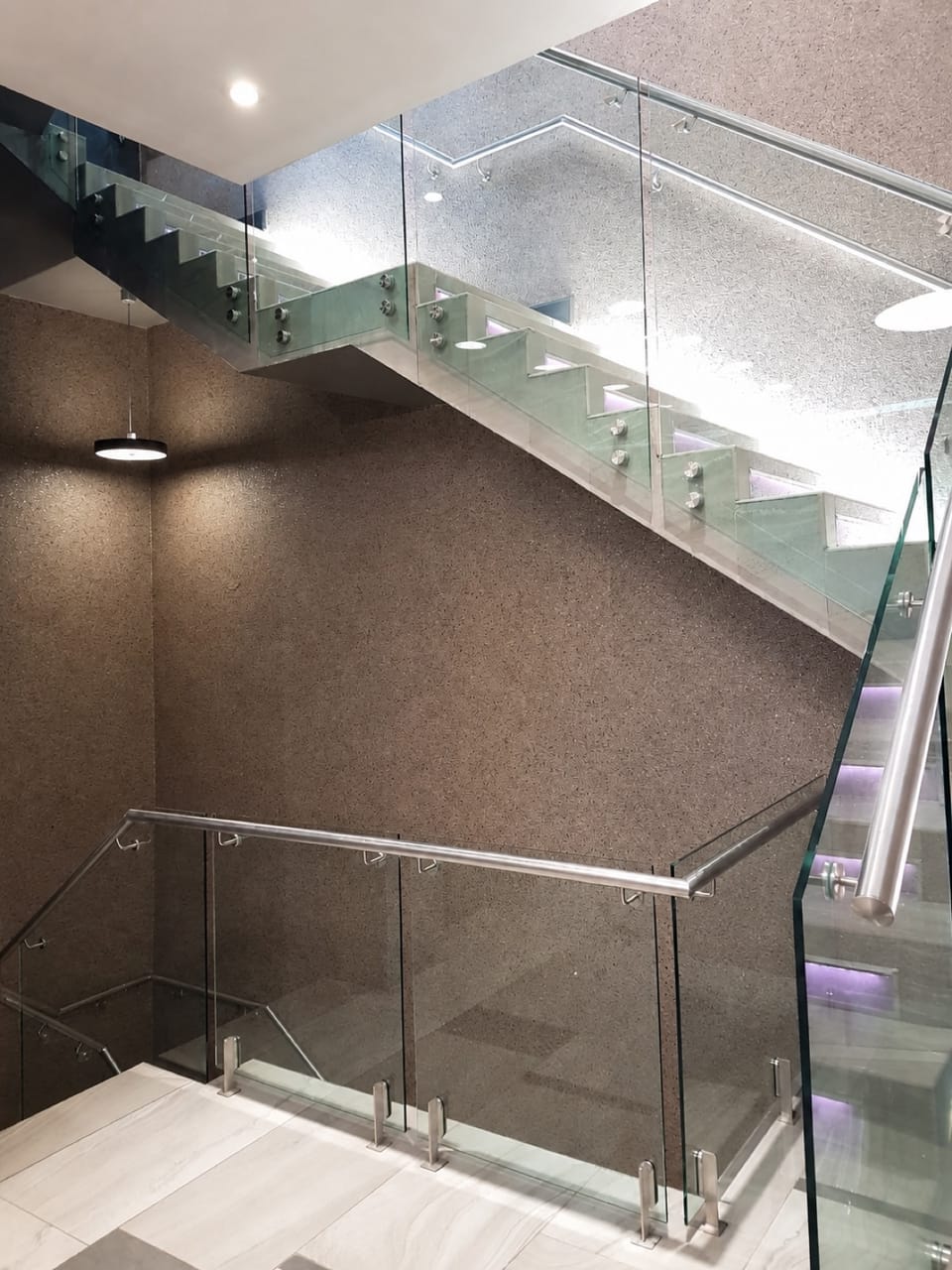 Capital Hotel, Menlyn Main — finished precast staircase with glass balustrades and lit treads